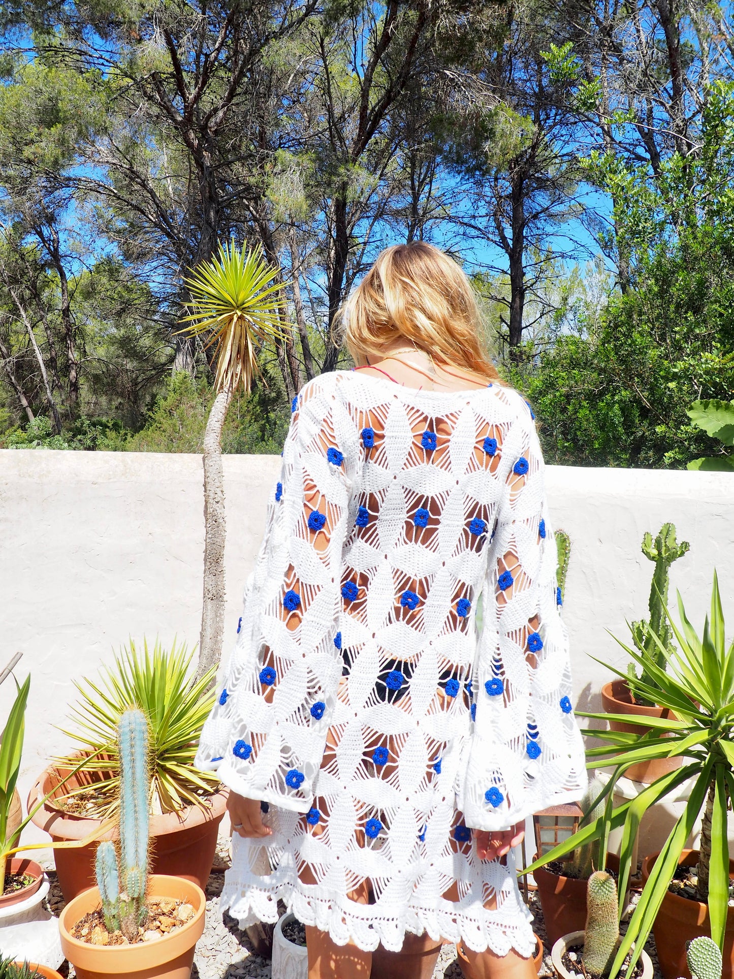 Amazing handmade vintage crochet textiles up-cycled bell sleeve dress with blue flower details by Vagabond Ibiza