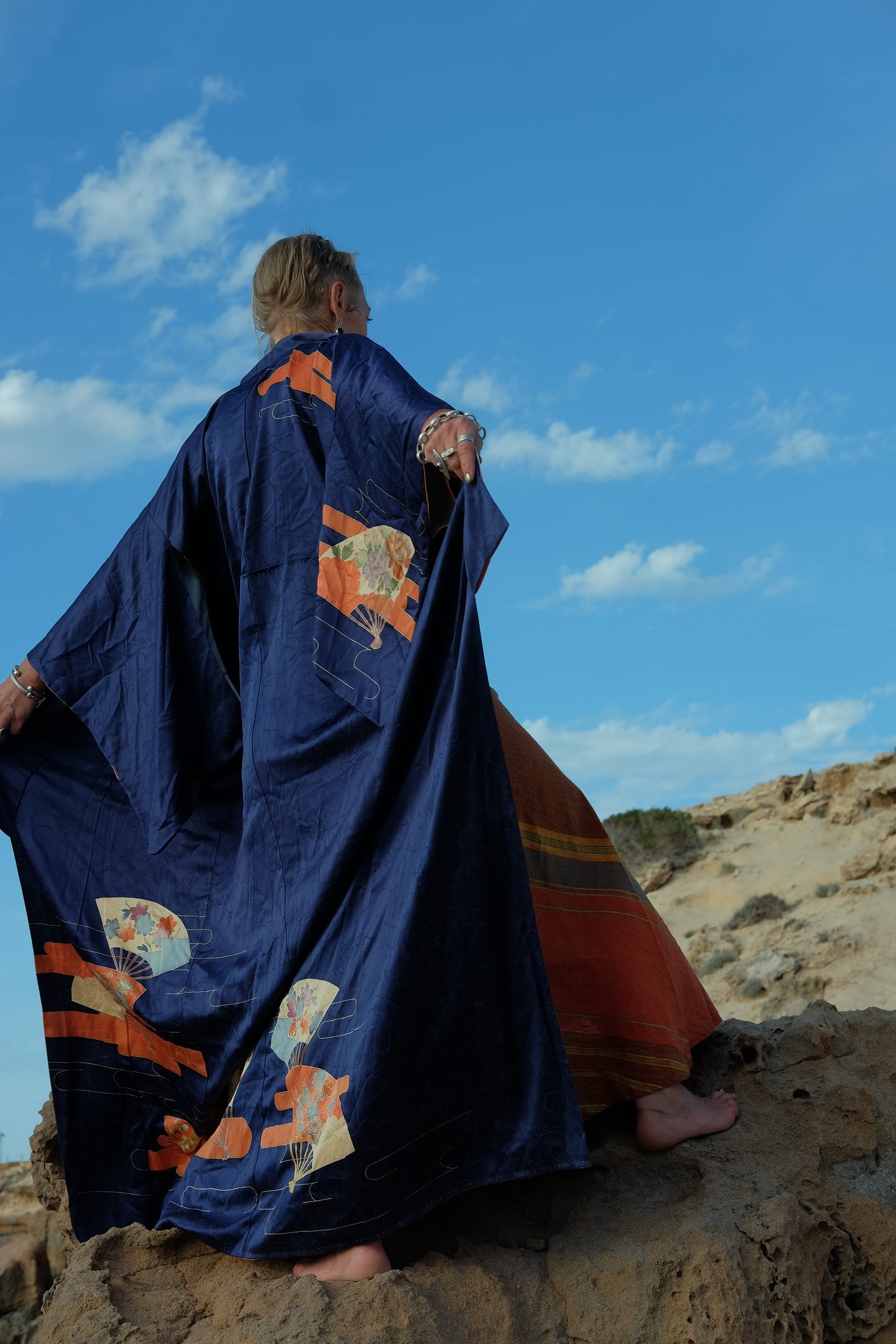 Vintage original silk Japanese kimono with traditional hand painted design in dark blue and orange tones