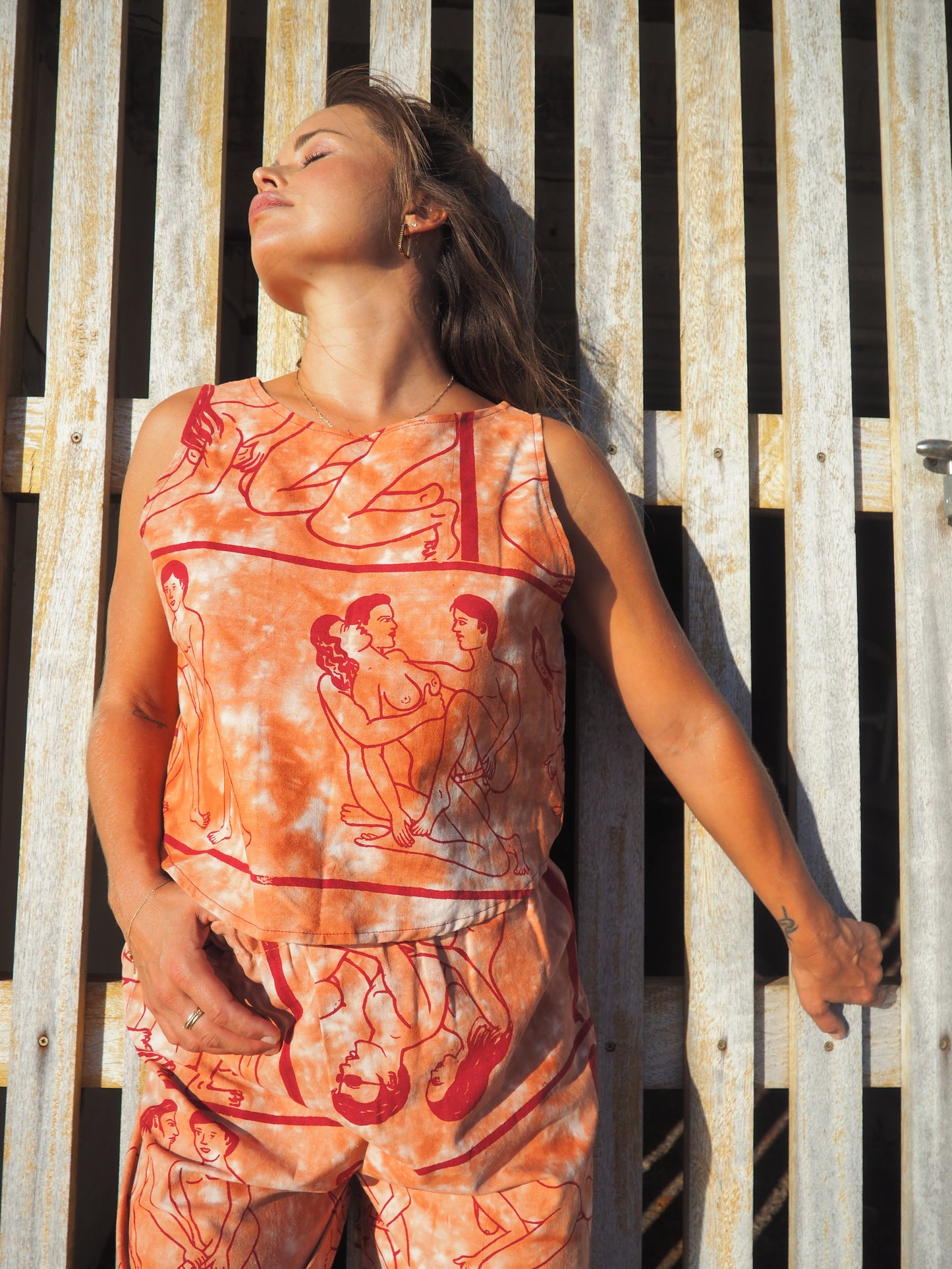 Up-cycled vintage cotton reversible crop top with printed karma sutra design in burnt orange.