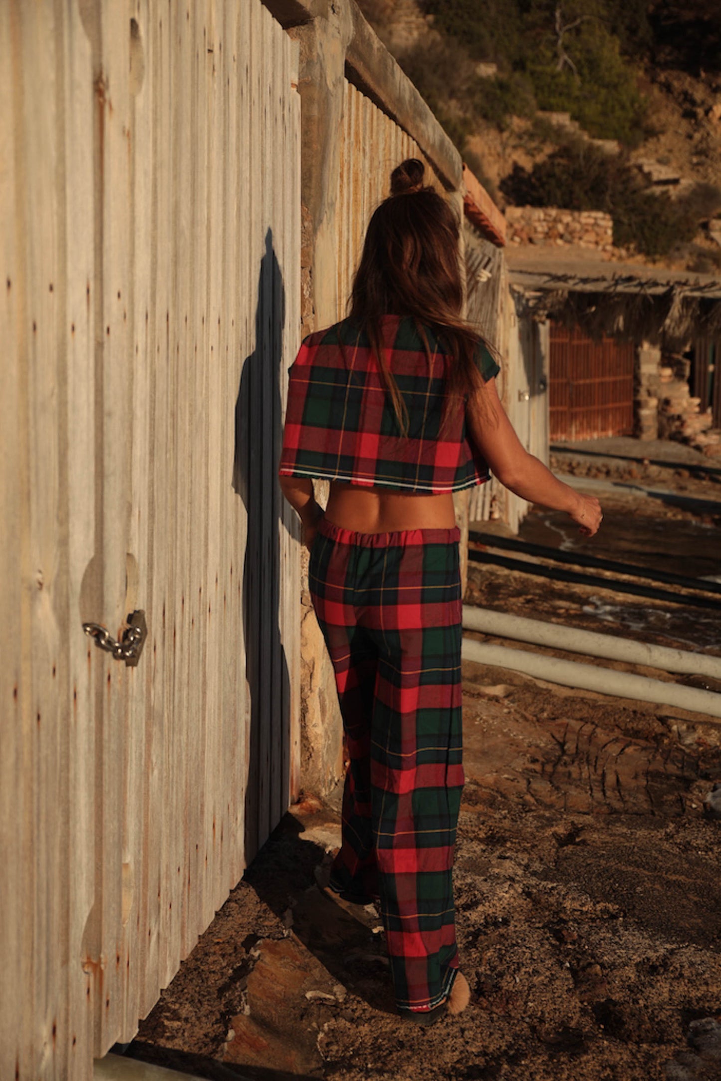 A stunning two-piece upcycled set featuring a vibrant red and blue checked design wide leg pants with elastic waste and crop top.