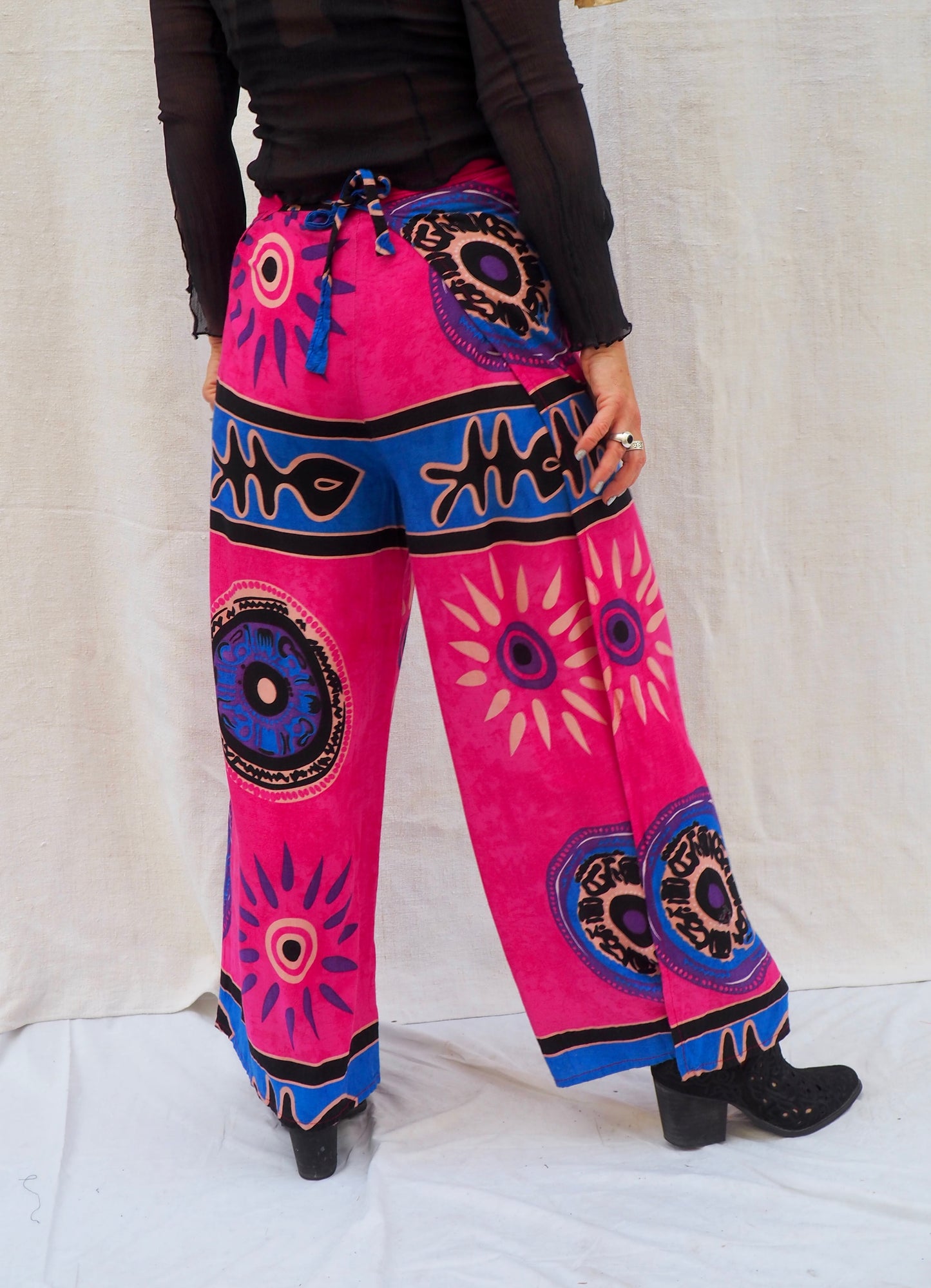 Wrap pants with side splits in pink and blue patterned design