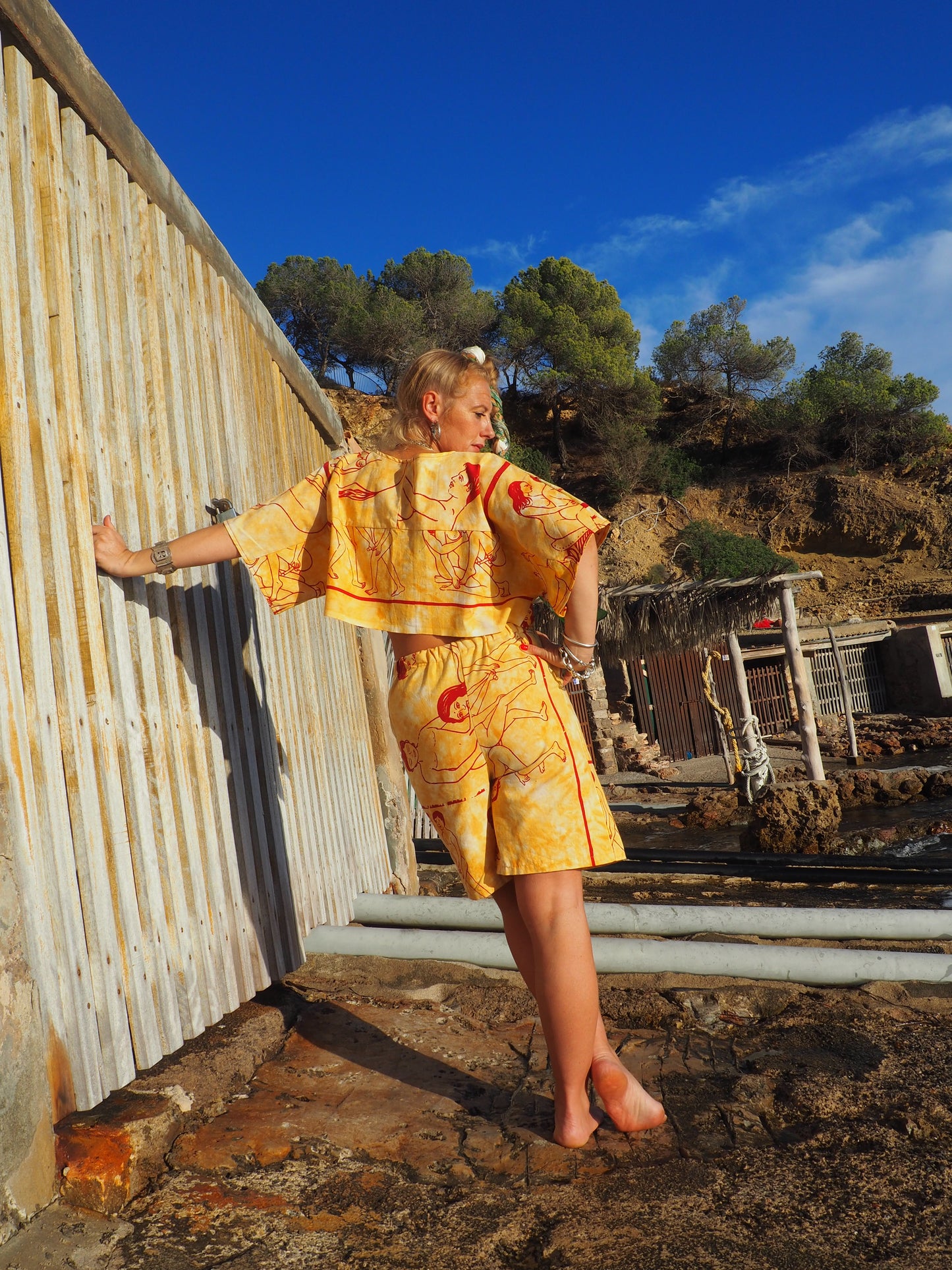 Up-cycled vintage cotton shorts with elastic waist and  printed karma sutra design mellow yellow