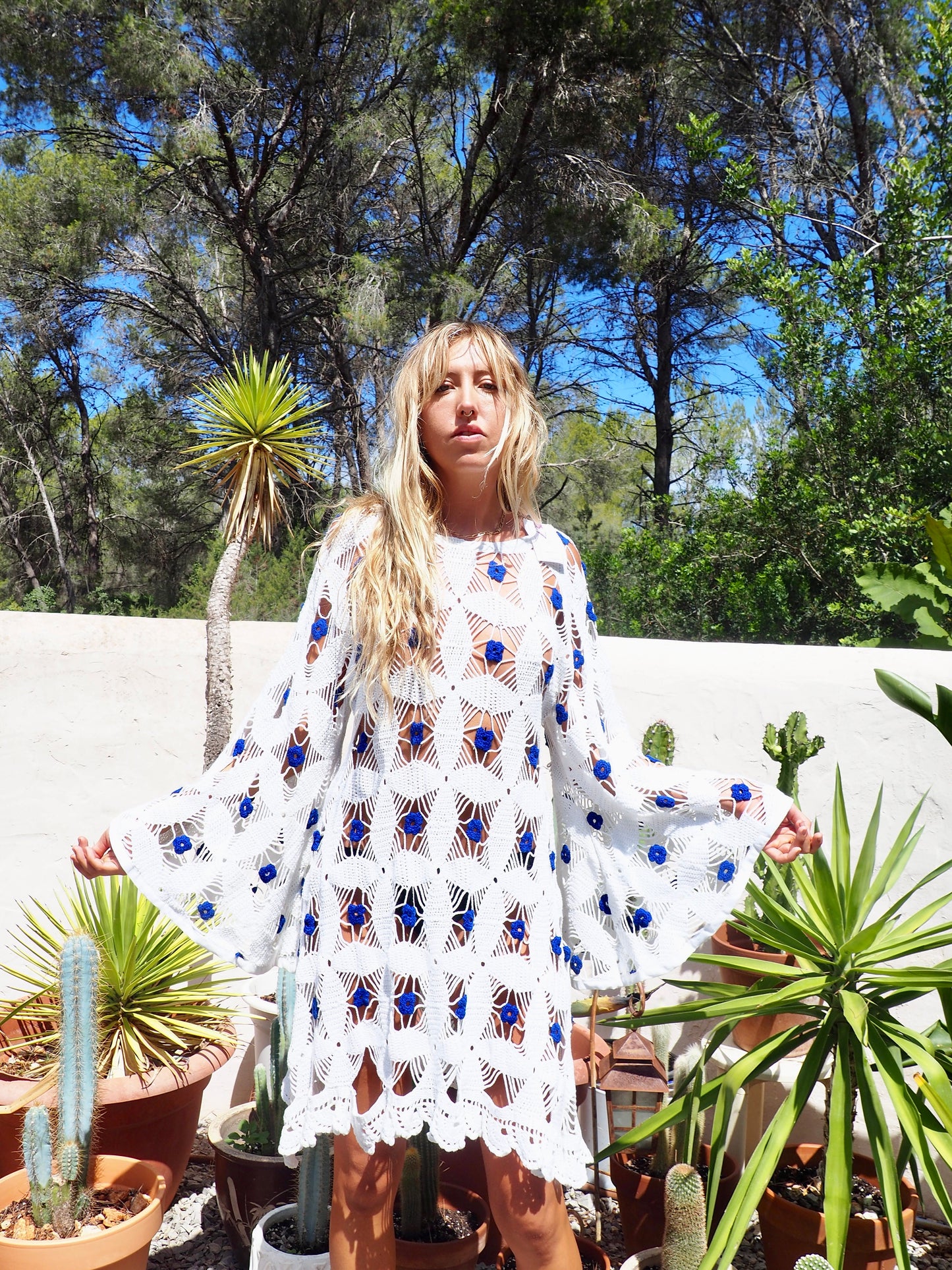 Amazing handmade vintage crochet textiles up-cycled bell sleeve dress with blue flower details by Vagabond Ibiza