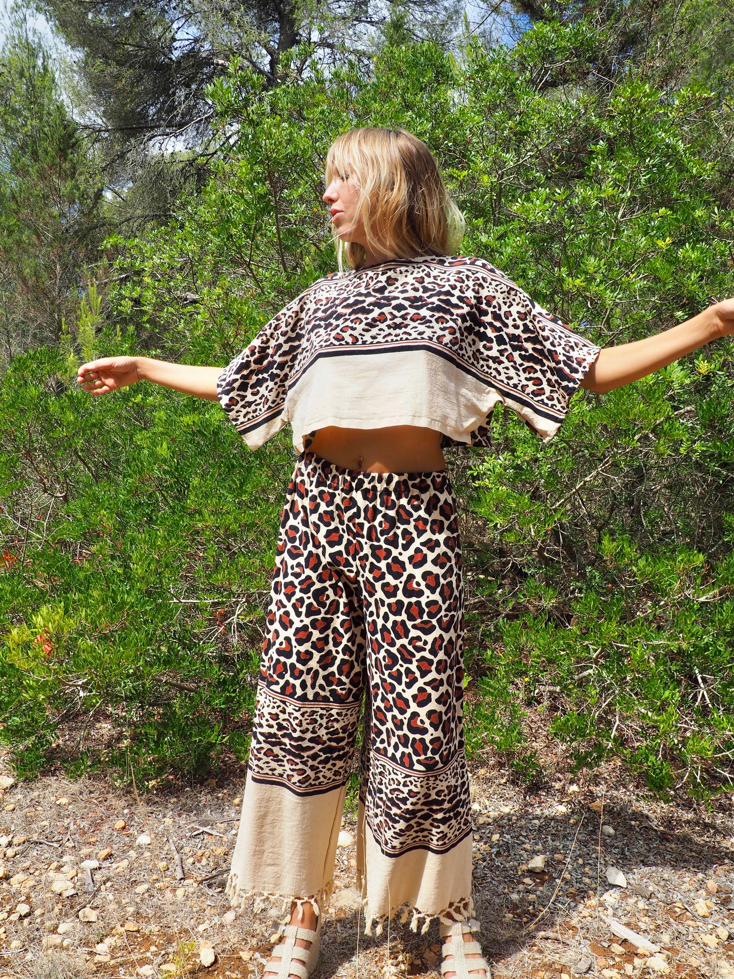 Up-cycled cotton black and cream animal print cropped top with sleeves made by Vagabond Ibiza