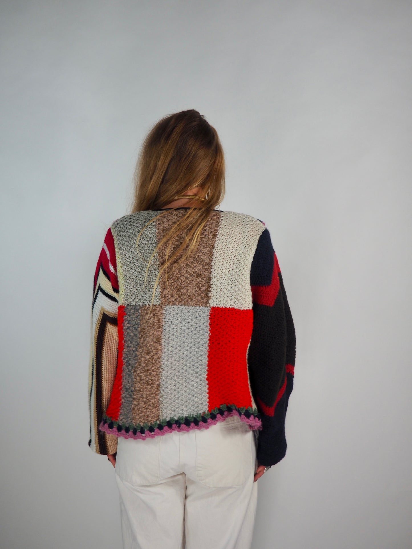 This one-of-a-kind vintage jacket is a true statement piece, crafted from a mix of cotton and wool crochet