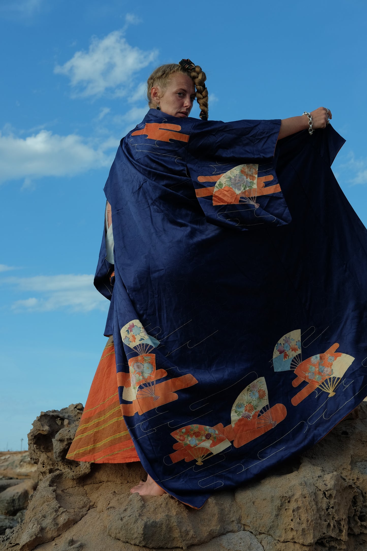 Vintage original silk Japanese kimono with traditional hand painted design in dark blue and orange tones