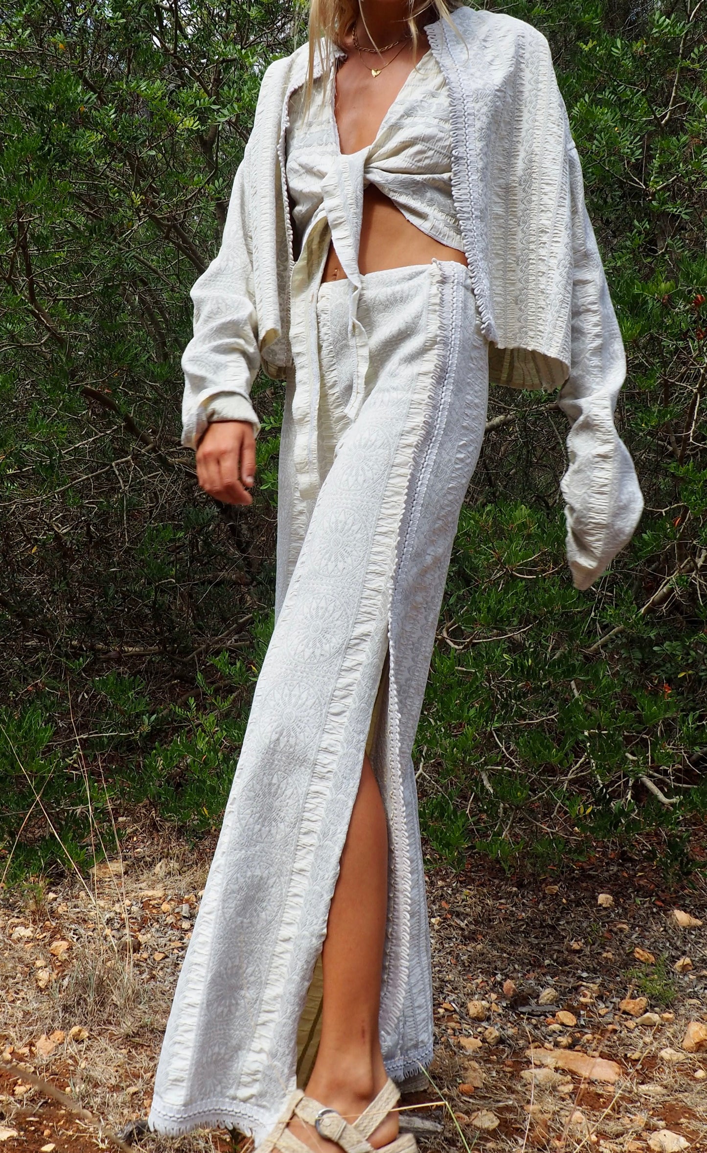 Up-cycled heavy cream and gray cotton woven textile wide leg pants with elastics and waist and side split details made by Vagabond Ibiza