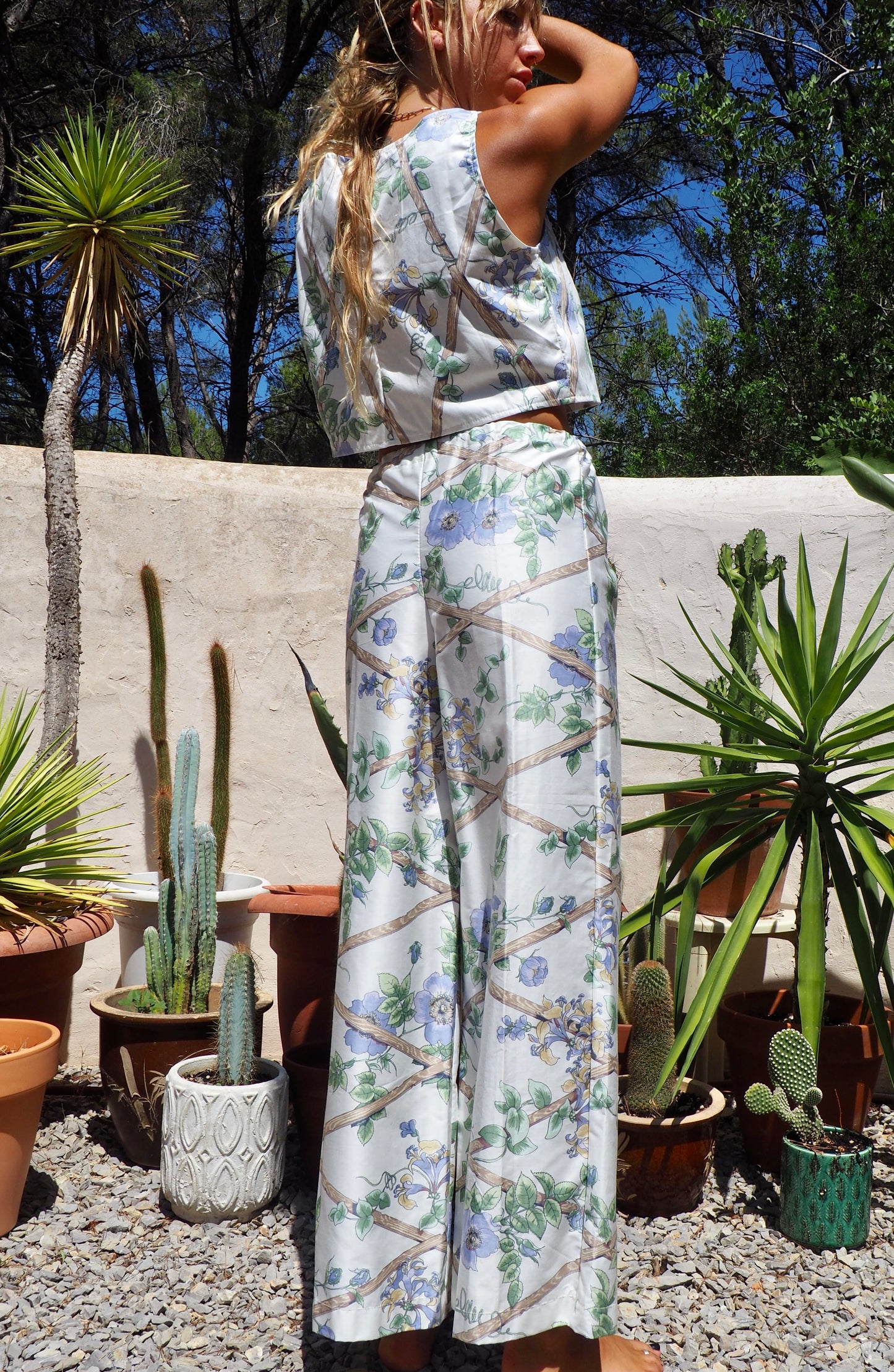 Up-cycled vintage garden floral printed textiles in white and blue wide leg pants with elasticated waist for fit by Vagabond Ibiza