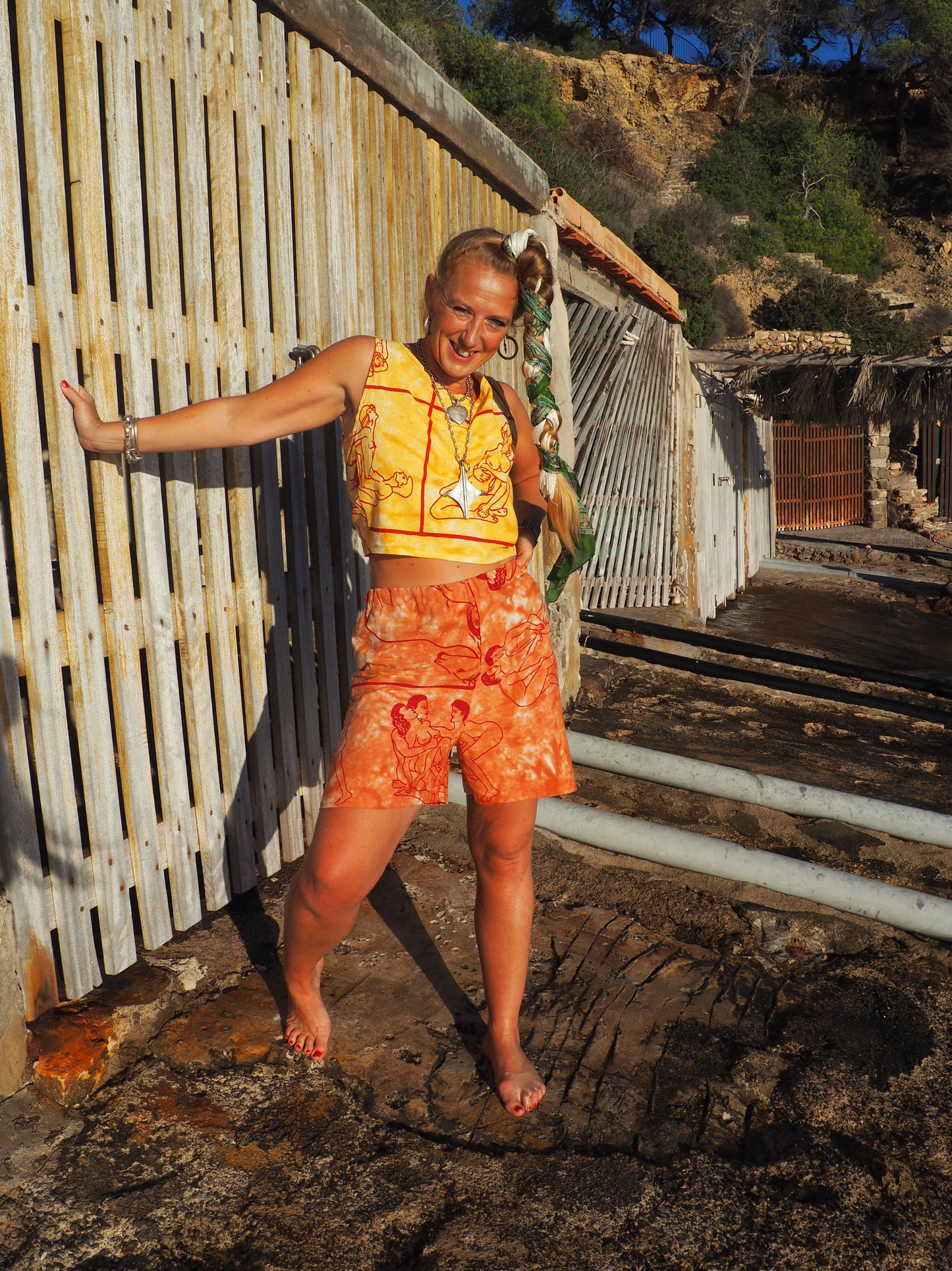 Up-cycled vintage cotton shorts with elastic waist and  printed karma sutra design in burnt orange