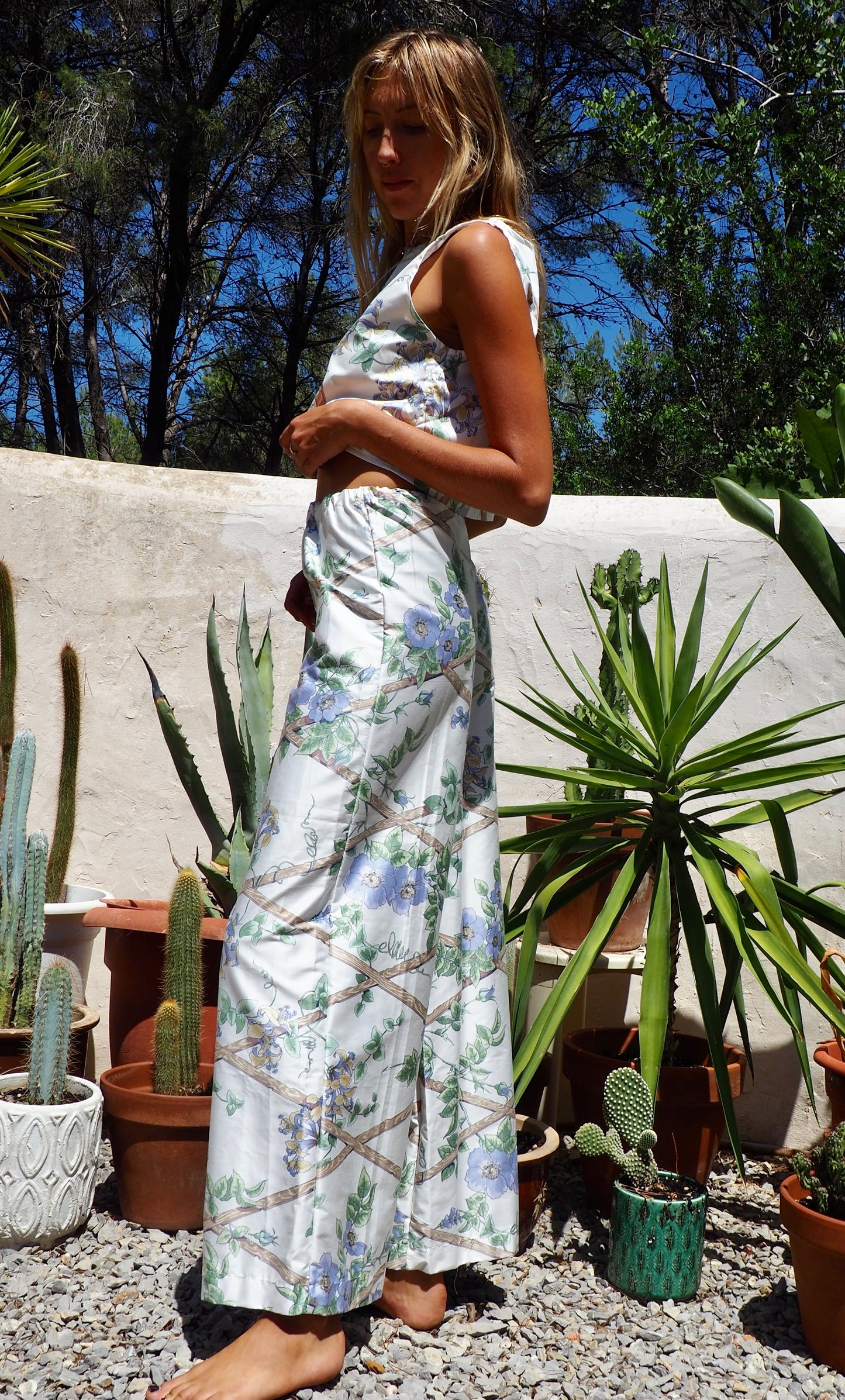 Up-cycled vintage garden floral printed textiles in white and blue wide leg pants with elasticated waist for fit by Vagabond Ibiza