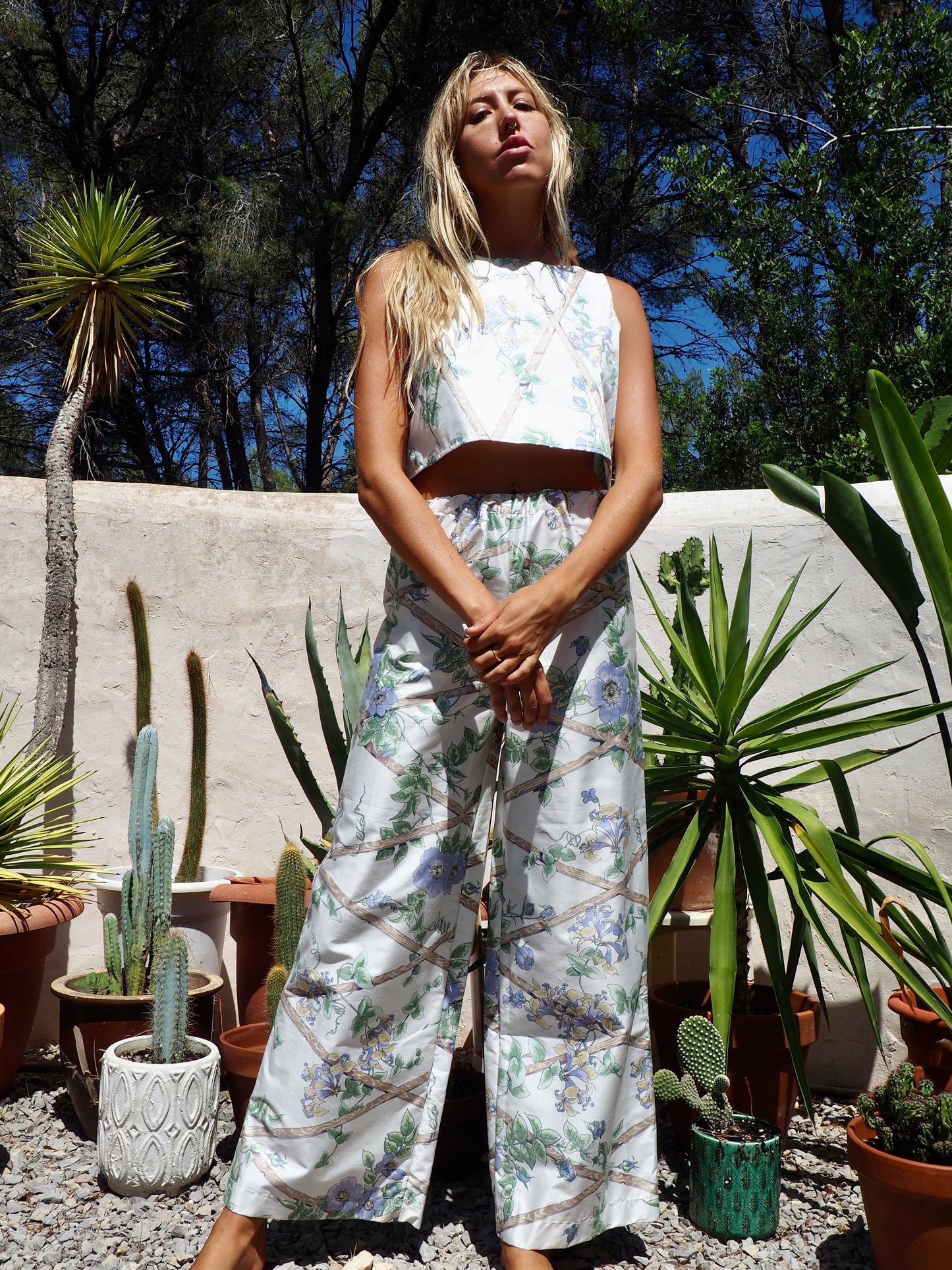 Up-cycled vintage garden floral printed textiles in white and blue wide leg pants with elasticated waist for fit by Vagabond Ibiza