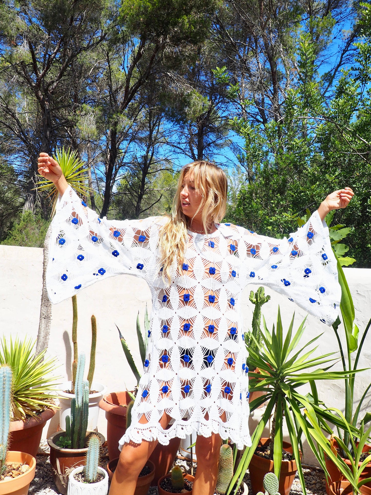 Amazing handmade vintage crochet textiles up-cycled bell sleeve dress with blue flower details by Vagabond Ibiza