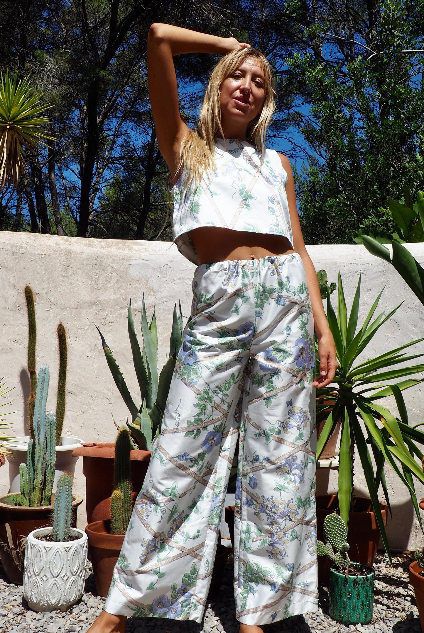 Up-cycled vintage garden floral printed textiles in white and blue wide leg pants with elasticated waist for fit by Vagabond Ibiza