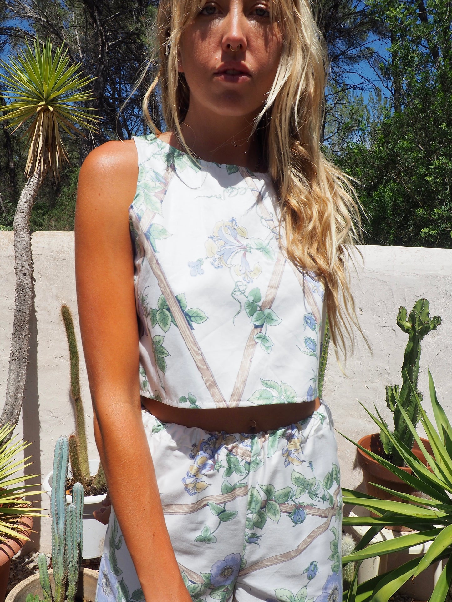 Up-cycled vintage garden floral printed textiles in white and blue crop top by Vagabond Ibiza in