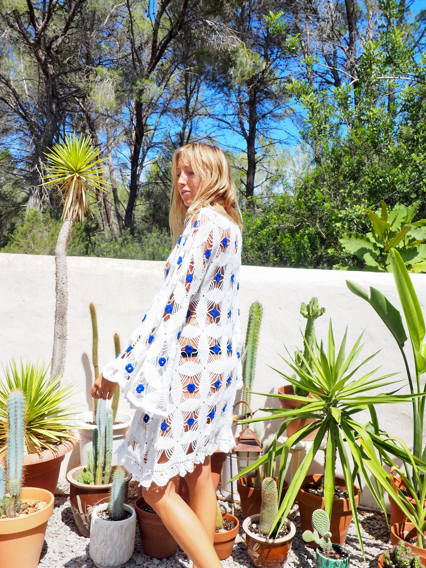 Amazing handmade vintage crochet textiles up-cycled bell sleeve dress with blue flower details by Vagabond Ibiza