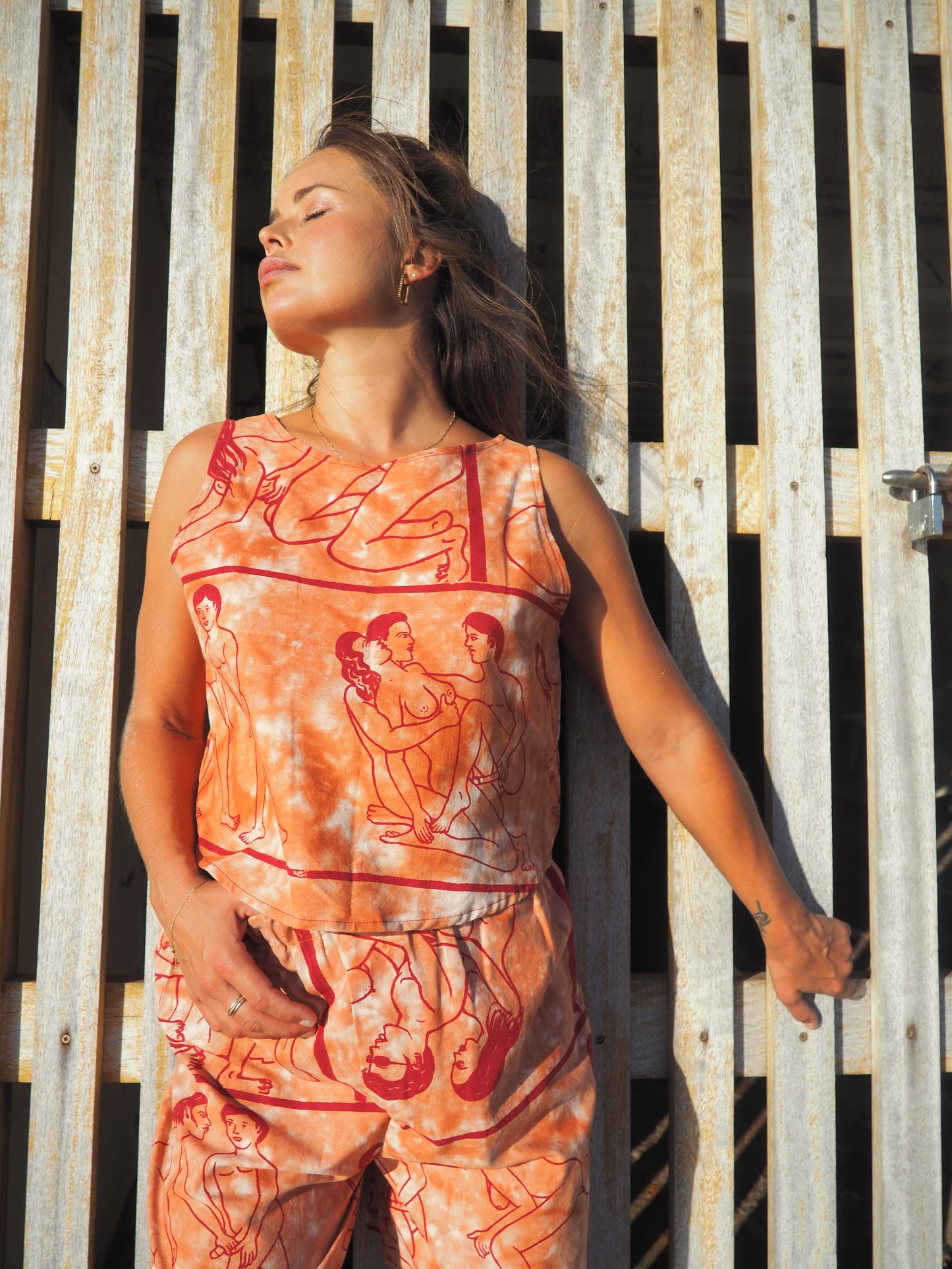 Up-cycled vintage cotton reversible crop top with printed karma sutra design in burnt orange.