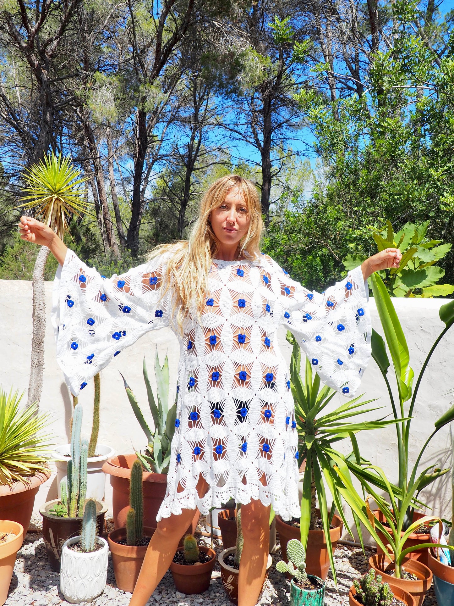 Amazing handmade vintage crochet textiles up-cycled bell sleeve dress with blue flower details by Vagabond Ibiza