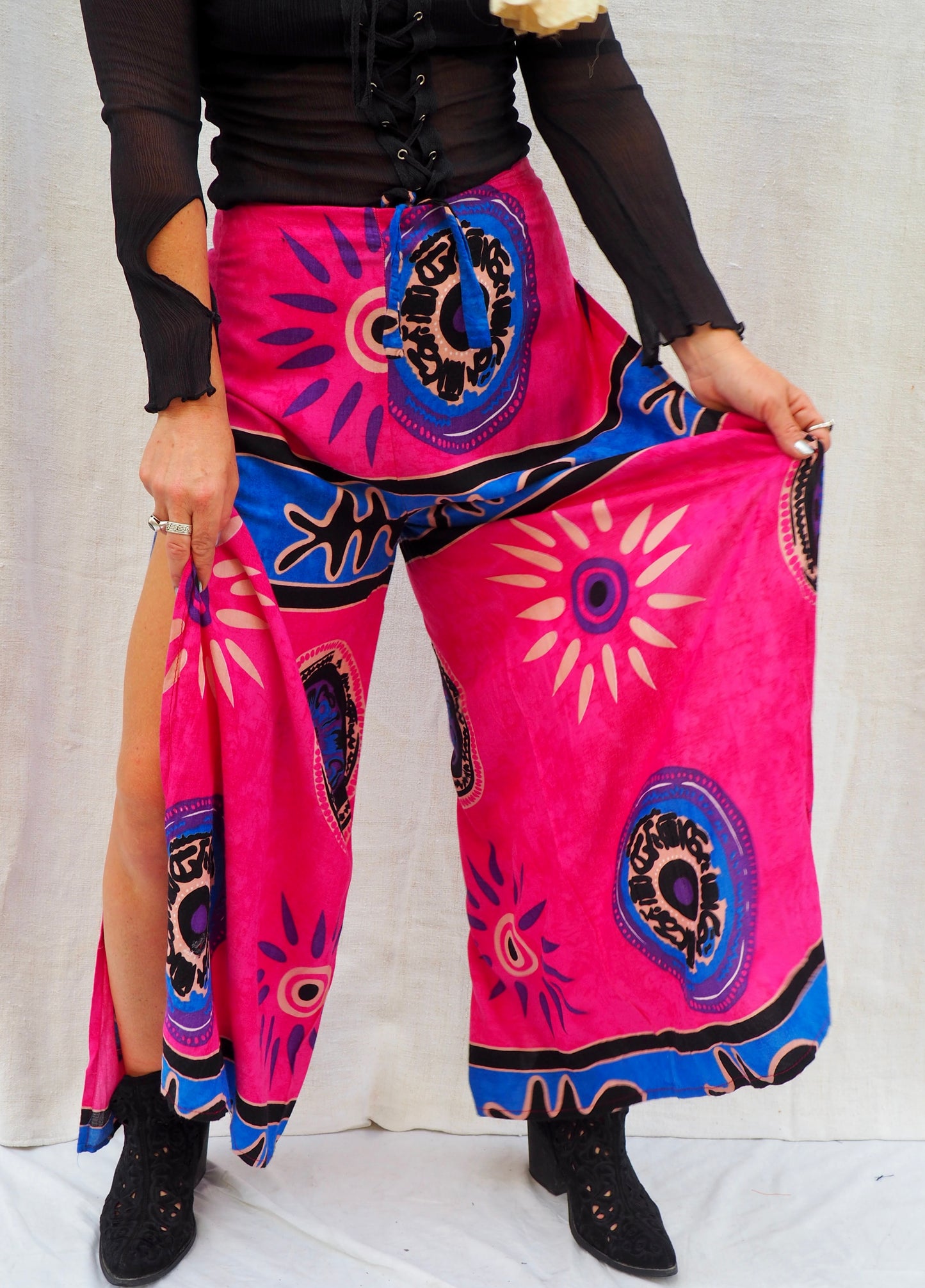 Wrap pants with side splits in pink and blue patterned design