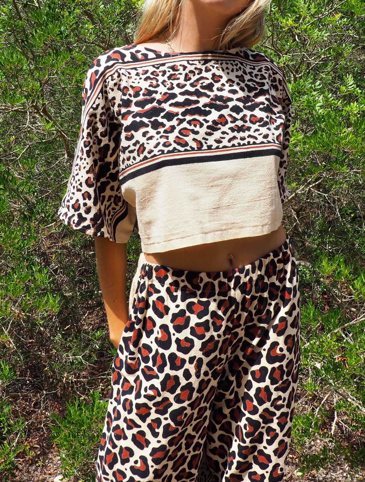 Up-cycled cotton black and cream animal print cropped top with sleeves made by Vagabond Ibiza