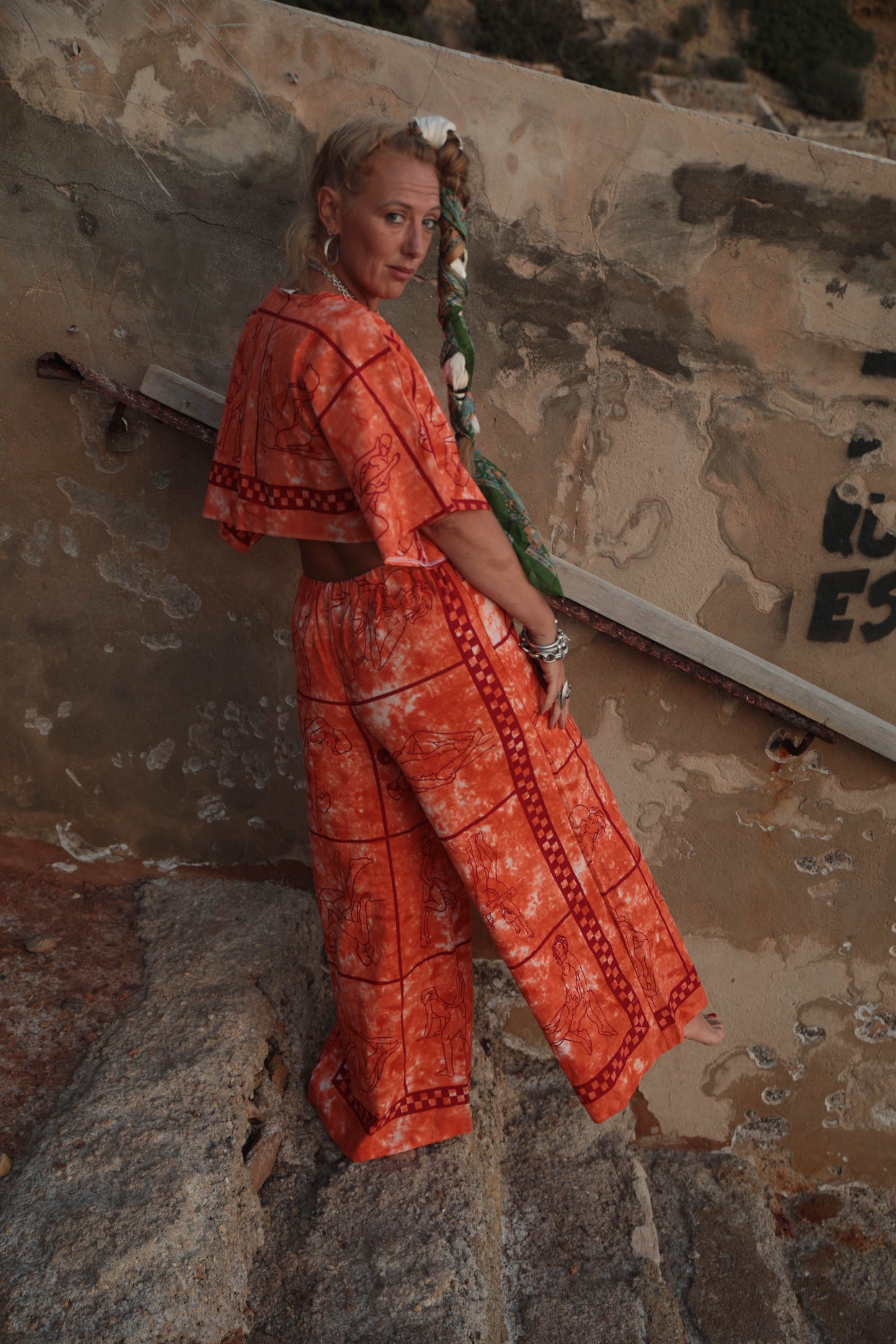 Up-cycled vintage cotton 2 piece set top and pants with printed karma sutra design in bright orange.