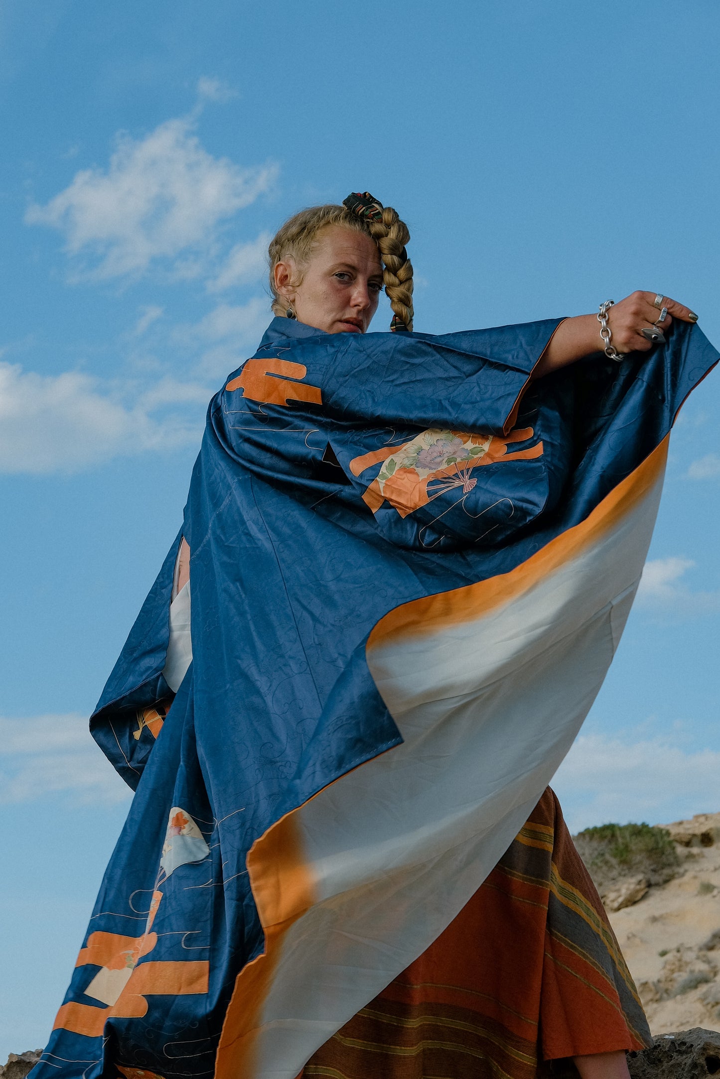 Vintage original silk Japanese kimono with traditional hand painted design in dark blue and orange tones