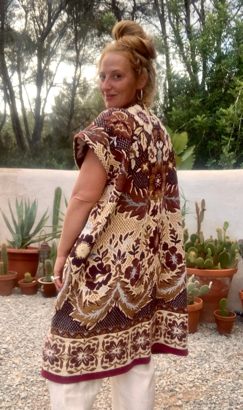 Up-cycled vintage blanket waistcoat jackets by Vagabond Ibiza with a brown and cream woven outside textiles lined with patterns fleece