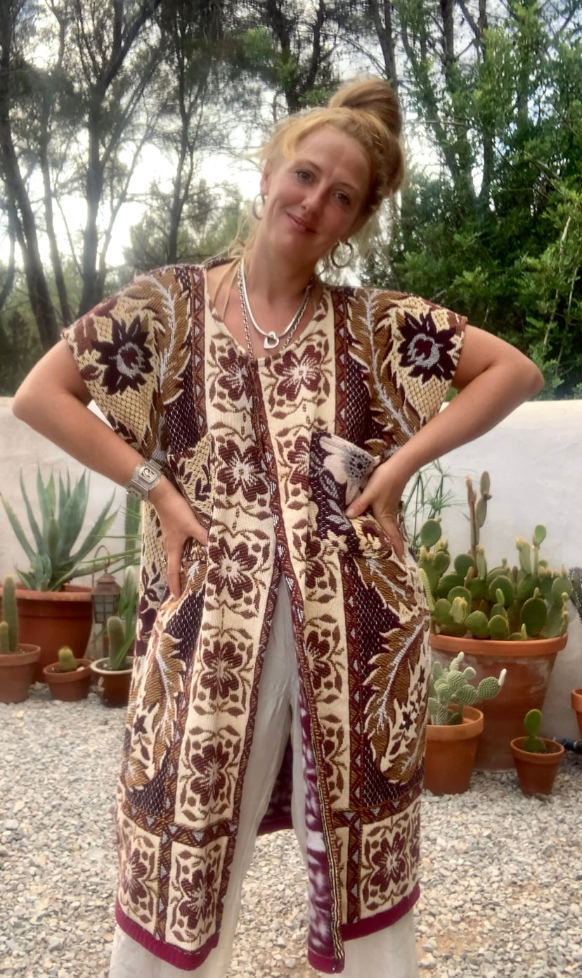 Up-cycled vintage blanket waistcoat jackets by Vagabond Ibiza with a brown and cream woven outside textiles lined with patterns fleece