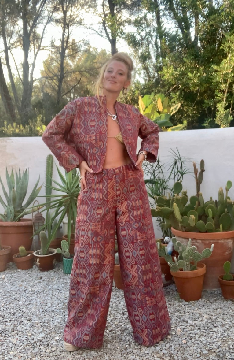Very cool 1970’s upholstery fabrics in burgundy wide cropped long sleeve jackets made by Vagabond Ibiza from recycled dead stock fabrics by Vagabond Ibiza