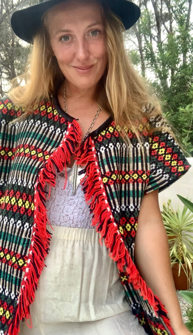 Up-cycled hand woven Morrocan textile waistcoat jacket by Vagabond Ibiza with red and black geometric design