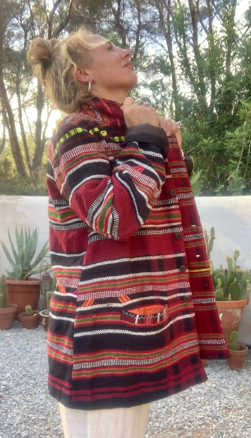 Original vintage woven Moroccan blanket jacket with red and black stripped design pockets and buttons up the front lined with black cotton